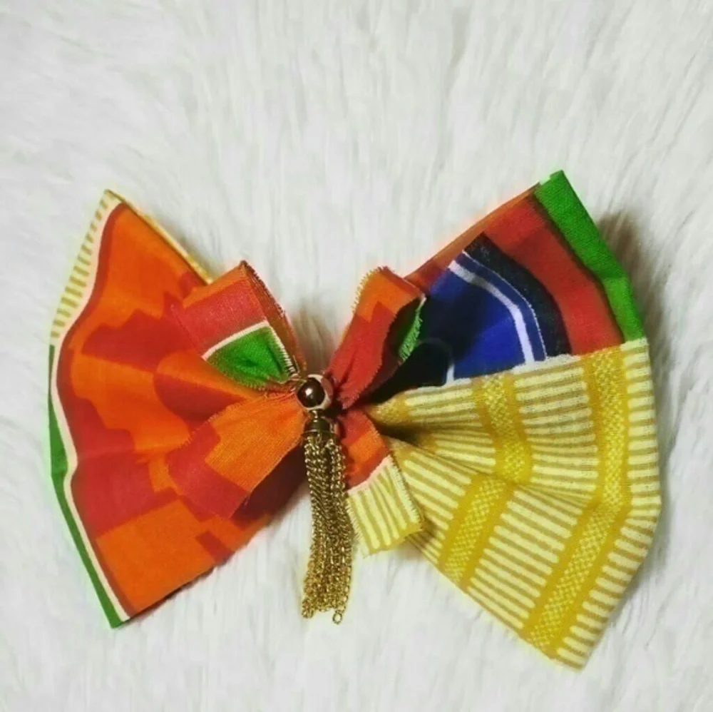 Tasty Raw Edge Kente Tassel Cleavage Bow Pin